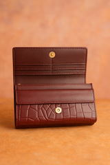 A Mehroon colored Crocodile Clutch