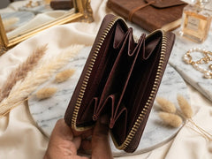 Women's Mehroon Genuine leather zip-around wallet with gold-tone zippers and multiple card slots Pakistan 